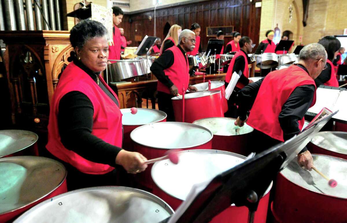 Tricia Daniel, left, of the St. Luke’s Steel Band performs with the Haven String Quartet at the Dr. Martin Luther King Jr. Community Celebration at St. Luke’s Episcopal Church in New Haven in 2012.