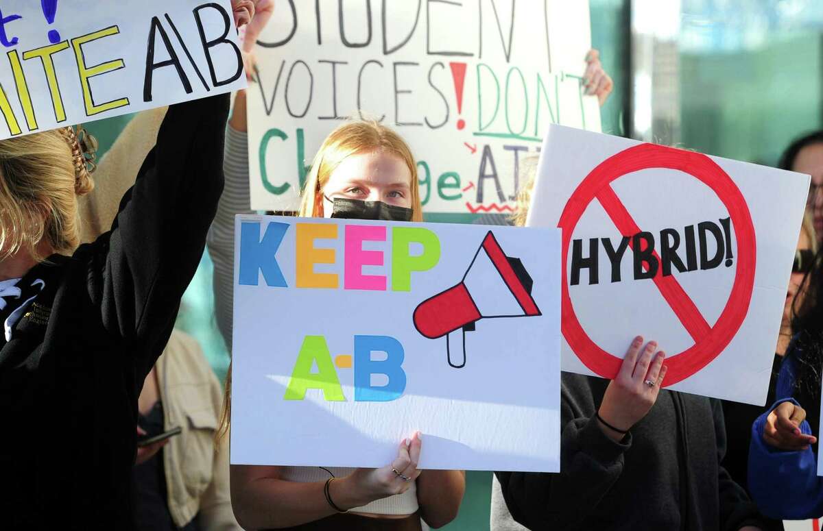 Student Michelle Paluchniak joins classmates, teachers and parents to protest against the school district’s proposed block schedule for next school year in front of the Goverment Center in downtown Stamford on Wednesday. The district is planning on implementing a “hybrid four-by-four” schedule across all three high schools — AITE, Westhill and Stamford High.