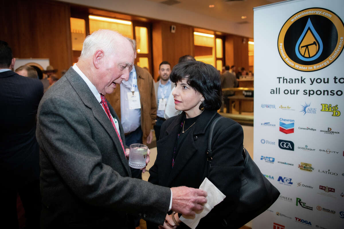Jim Woodcock, Founder and Board Chair of the Permian Basin Water In Energy Conference speaks with Railroad Commissioner Christi Craddick during the Permian Basin Water in Energy conference dinner banquet February 23, 2022 at the Petroleum Club in Midland. The two day conference featured more than two dozen speakers and 400 registered participants. Photo Credit: The Oilfield Photographer, Inc.