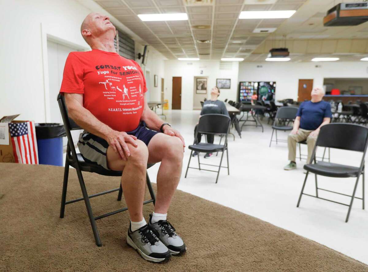 Veteran Jim McDermott instructs a yoga class made up of other veterans, auxiliary members and seniors at the Veterans of Foreign War Post 4709, Tuesday, Feb. 22, 2022, in Conroe.