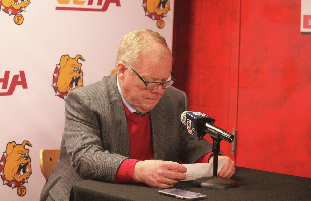 Ferris State coach  Bob Daniels reviews the final stat sheet after last Saturday's game with Michigan Tech.