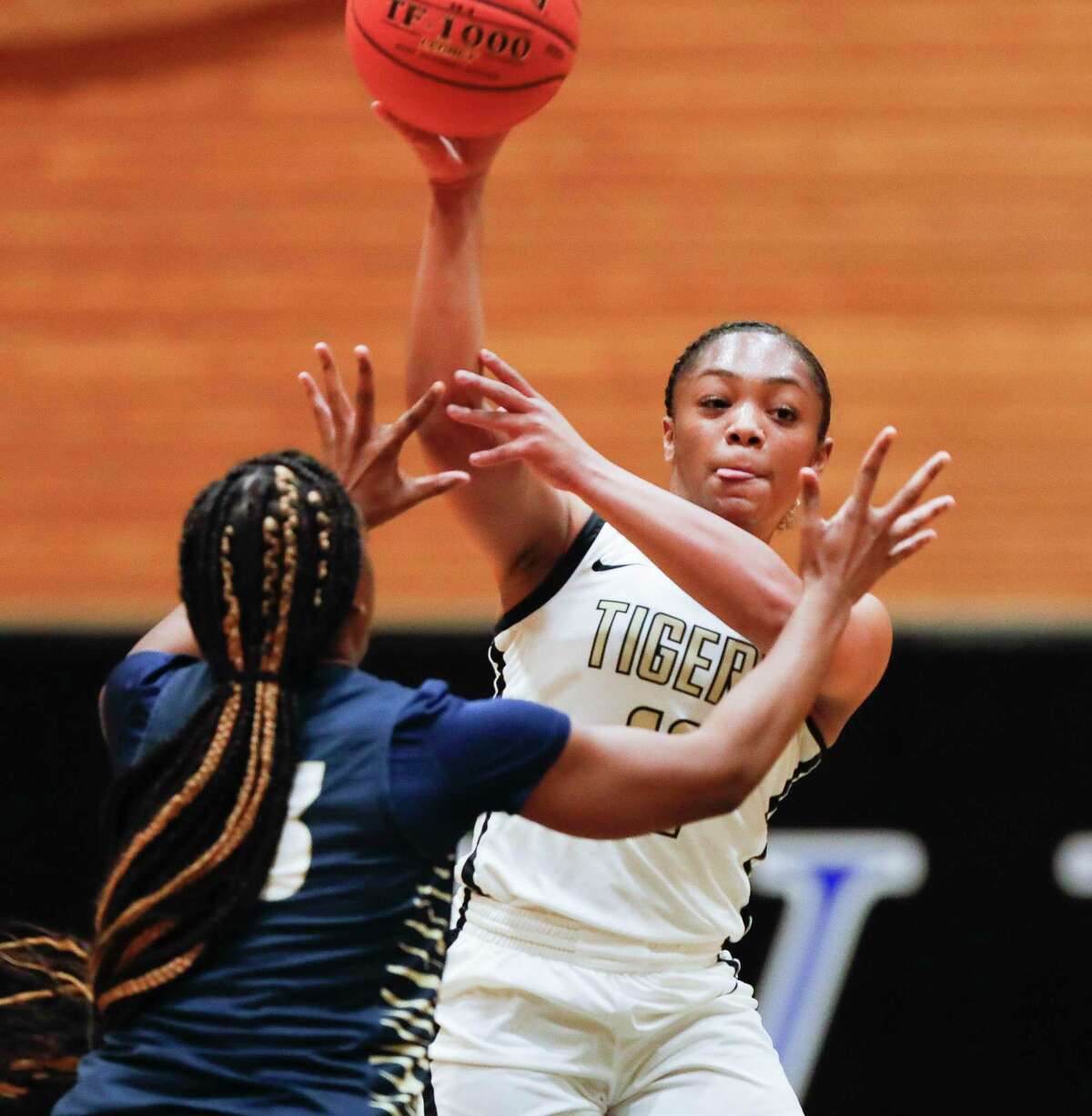 Conroe's Kennedy Powell (11) makes a long pass during the third quarter of a Region II-6A quarterfinal high school basketball playoff game at Dekaney High School, Tuesday, Feb. 22, 2022, in Spring.