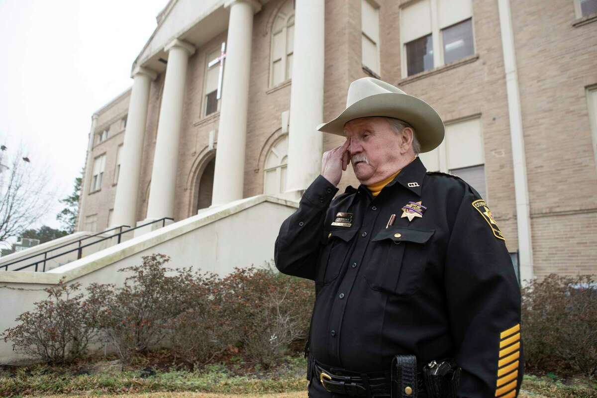 San Jacinto County Pct. 1 Constable Roy Rogers stands outside the county courthouse mourning the loss of slain Deputy Neil Adams Thursday, Feb. 24, 2022 in Coldspring. Deputy Neil Adams, a San Jacinto County Precinct 1 Constable’s Deputy was fatally shot at PlazAmericas shopping mall in Sharpstown where he was working an extra security job Wednesday afternoon, Houston Police said.