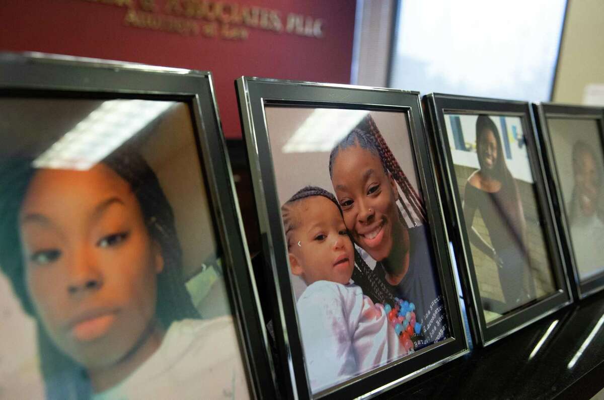 Photographs of Autrey Davis, was killed after a Harris County Sheriff’s deputy collided with her while pursuing a suspected criminal, is on display during a press conference calling for the releasing of the deputy’s dash camera footage Thursday, Feb. 24, 2022, in Houston. Davis family and Payne family, another victim died in a separate officer-invovled crashing, and their attorneys also call for law enforcement agencies to change their policies on high-speed pursuits.
