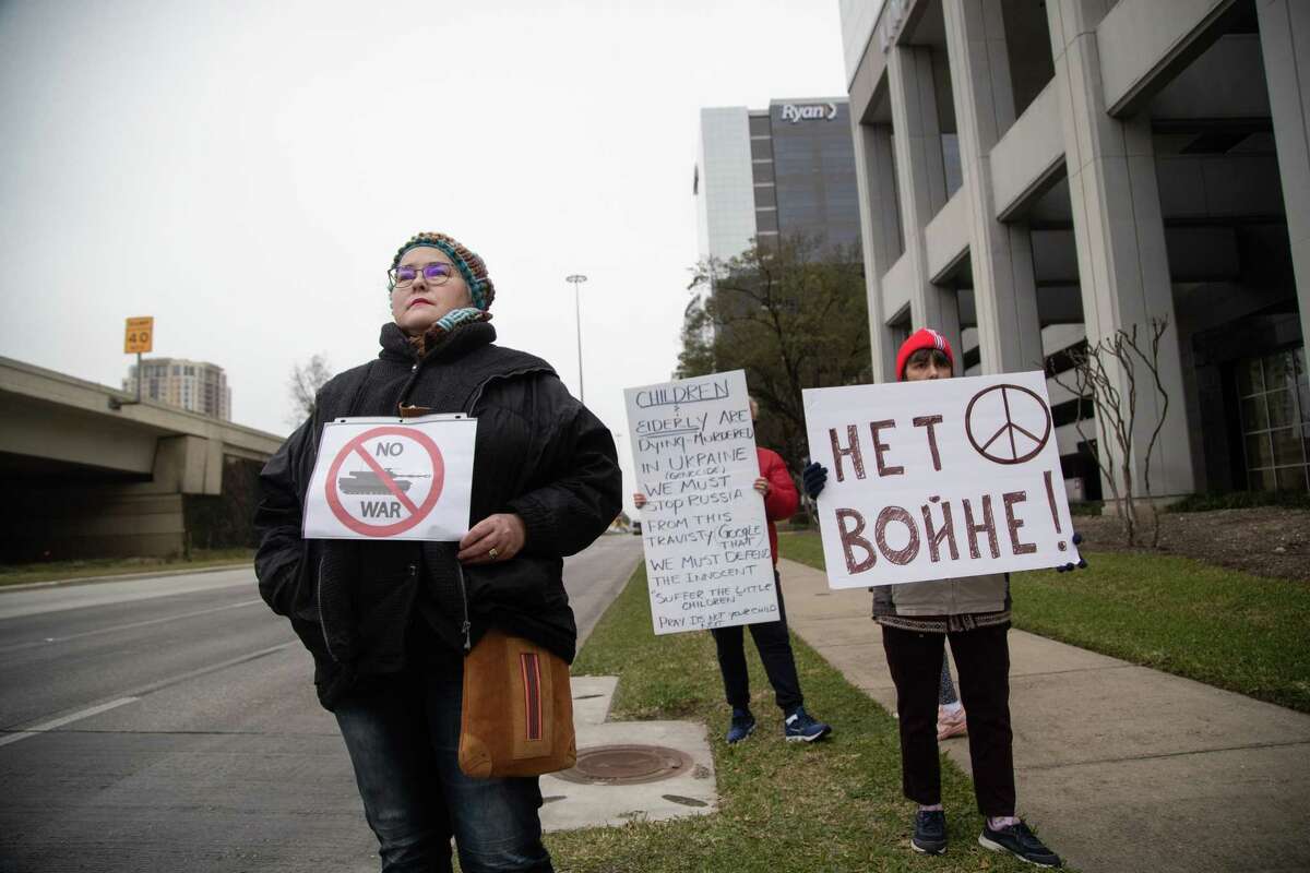 Ana Adrianova, a Russian resident of Houston. holds a sign that says “no war” at a peaceful protest in front of the Russian consulate in Houston on the day Russian military attacked the independent nation of Ukraine, Thursday, Feb. 24, 2022, in Houston.