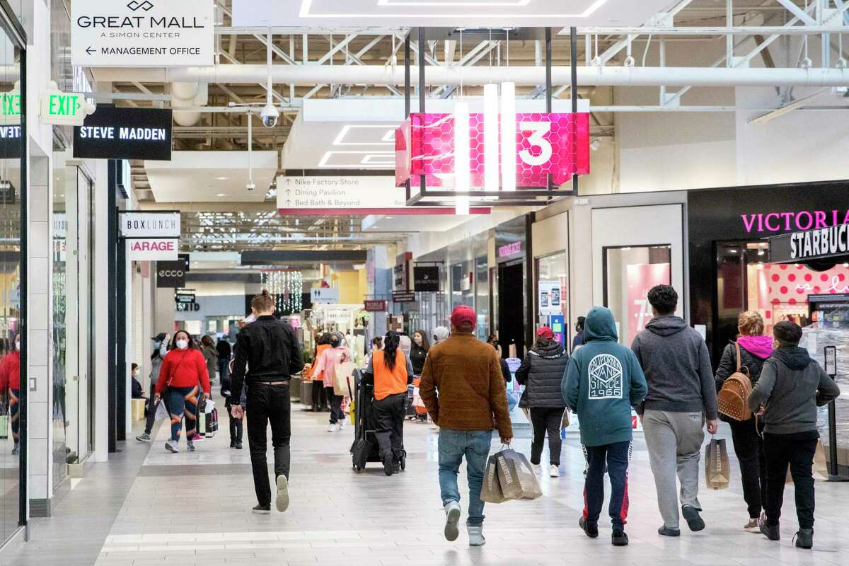 Shoppers inside the Great Mall in Milpitas in 2020. Once the mask mandate is dropped, people will still be strongly advised to continue wearing face coverings indoors, officials say.
