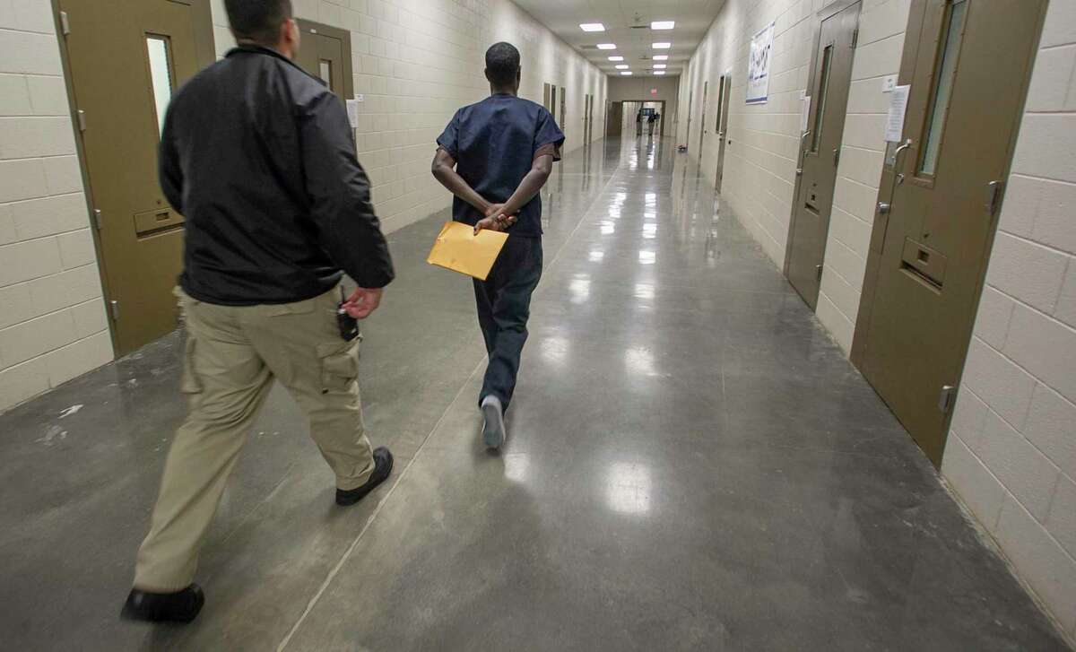 An asylum seeker (right) at the Imperial Regional Detention Facility in Calexico (Imperial County).