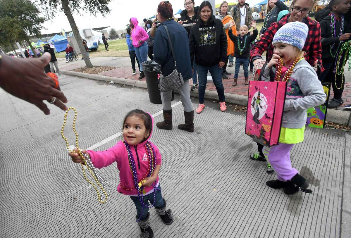 Familiies got their first beads as the Mardi Gras of Southeast Texas began Thursday with the Courir de Mardi Gras Parade. The event runs through Sunday on the grounds surrounding the Event Centre. Photo made Thursday, February 24, 2022 Kim Brent/The Enterprise
