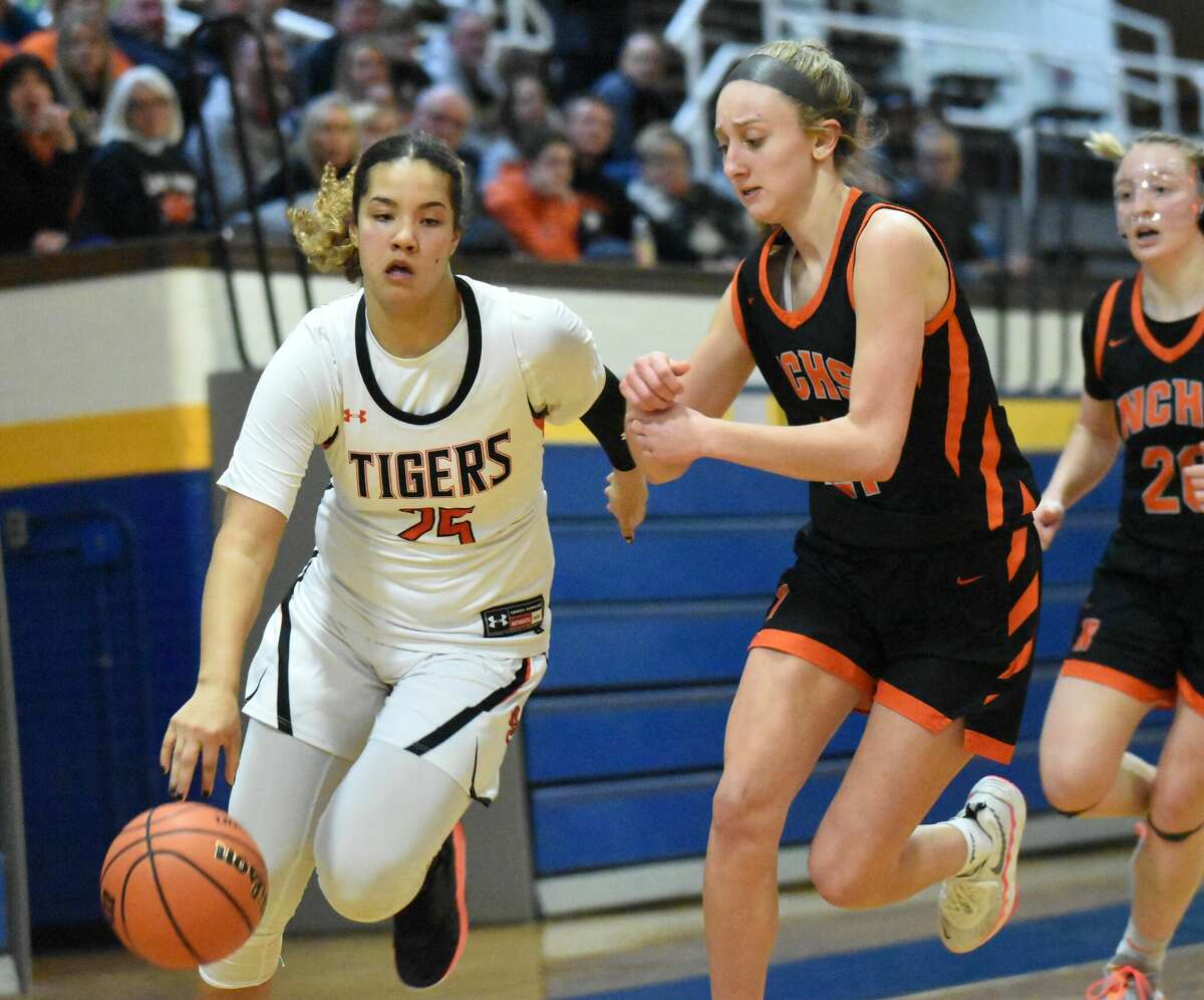 Edwardsville's Sydney Harris drives to the basket against Normal Community in the second half of the Class 4A Joliet Central Sectional championship game in Joliet.