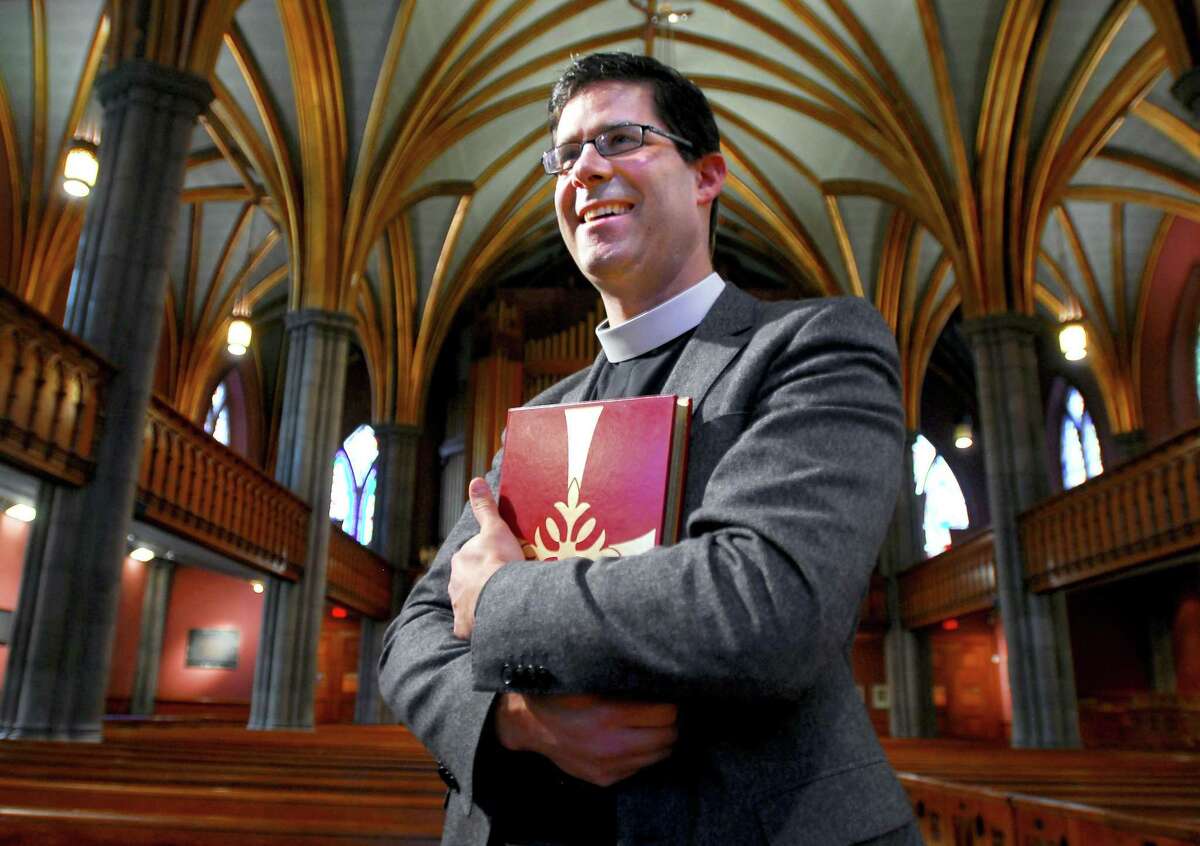 Rev. Luk De Volder is photographed at Trinity Episcopal Church on the Green in New Haven.