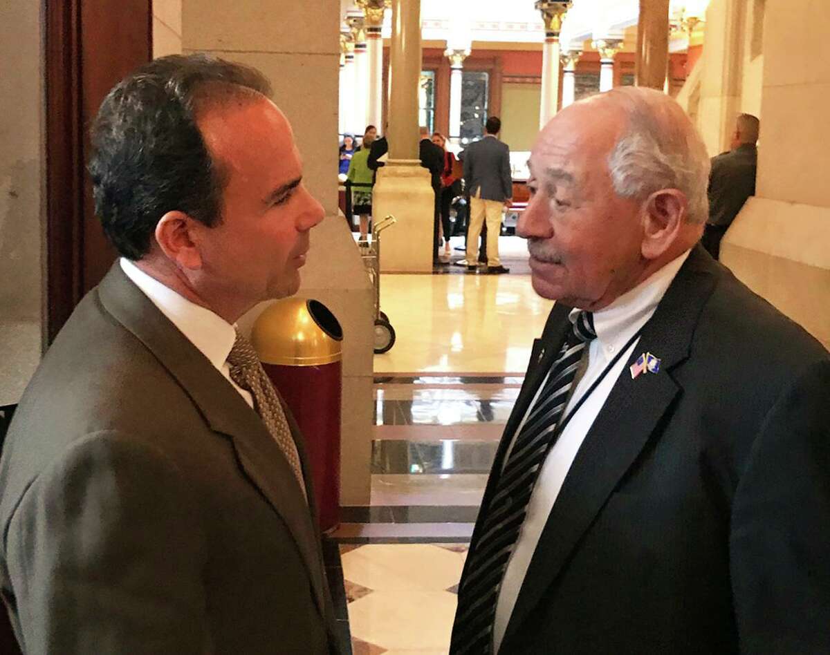 Bridgeport Mayor Joe Ganim confers in May 2017 with state Sen. Steve Cassano, D-4th, in Hartford, Conn. Cassano co-chairs the Planning & Development Committee of the Connecticut General Assembly, which will weigh whether to move ahead with a 2022 bill that would allow municipalities to push back the revaluation process by a year.