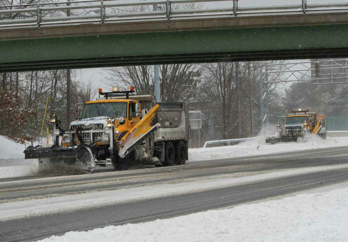 Snowplows clear the snow off Western Avenue during a snow storm on Feb. 25 in Guilderland.