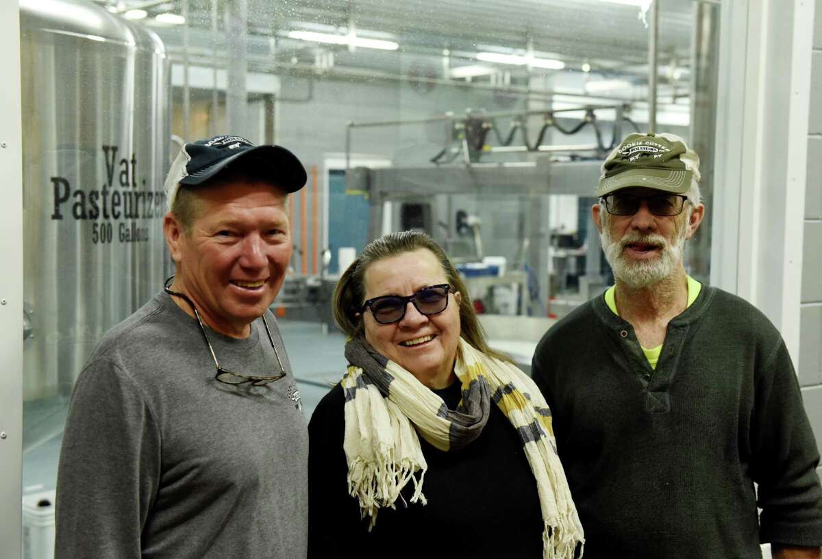 Argyle Cheese partners; Ideal Dairy's John Dickinson, left, Marge Randles, center, and her husband, Dave, right, of Argyle Cheese on Wednesday, Feb. 23, 2022, at Argyle Cheese Farm Stop & Bakery in Hudson Falls, N.Y. Argyle Cheese recently merged with Ideal Dairy.