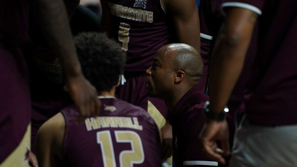 Head coach Terrence "TJ" Johnson talks to his players during the Bobcats' February 23 win over South Alabama. 