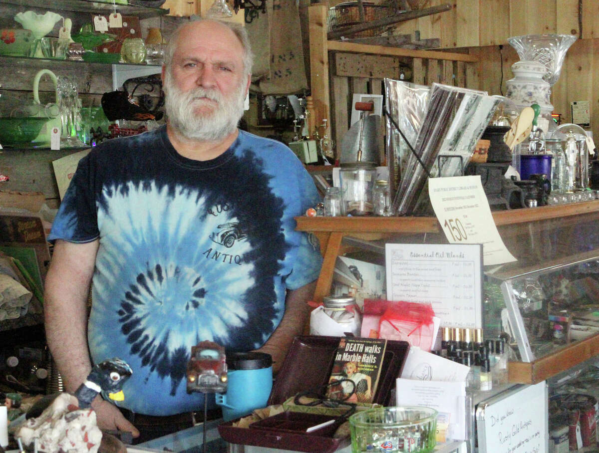 Rusty Gold Antiques owner Joe Bixman is happy with his new storefront on downtown Evart.