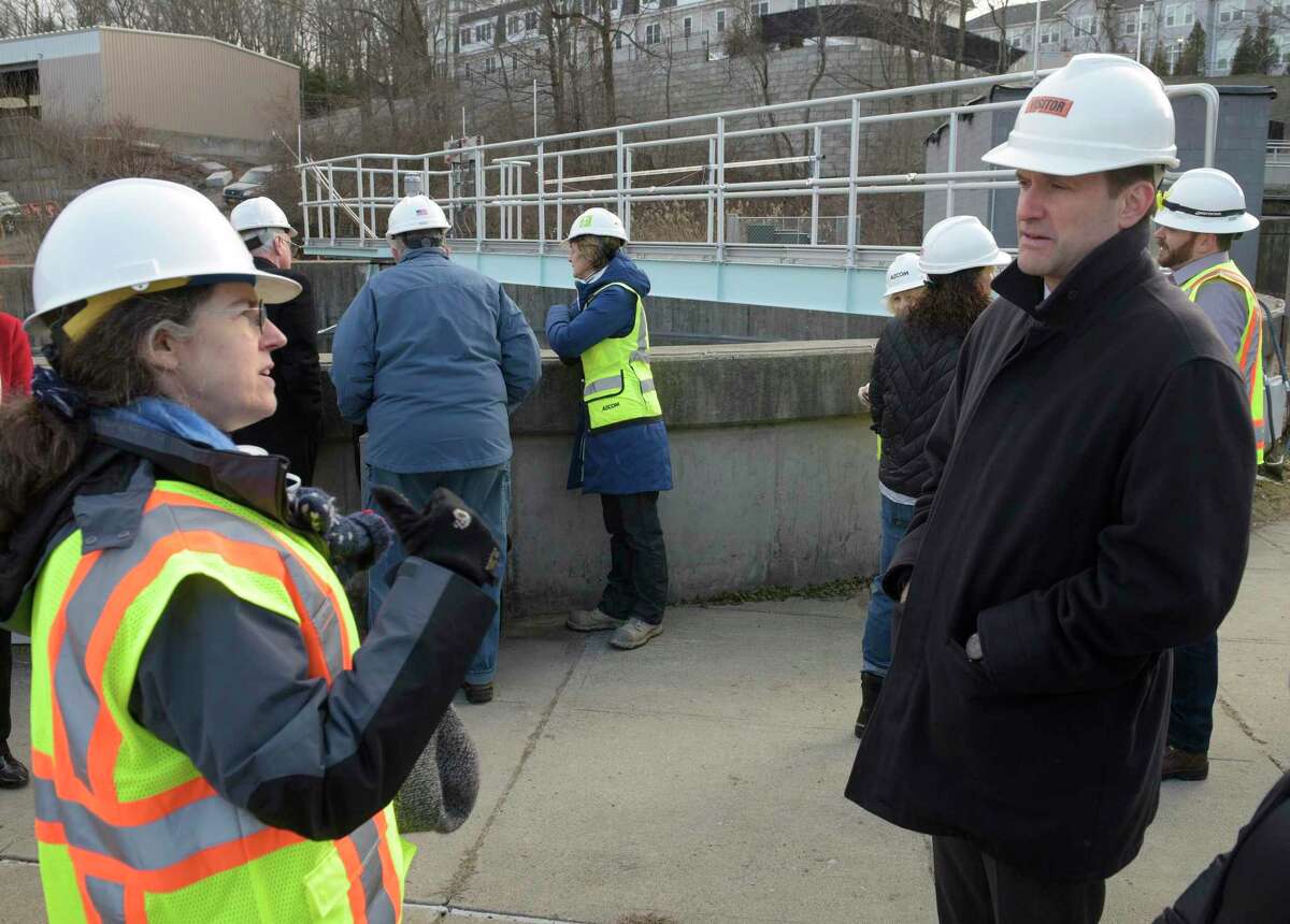 U.S. Rep. Jim Himes, right, talks with Water Pollution Control Authority Chair Amy Siebert during a tour of the Ridgefield wastewater improvement project on Thursday afternoon. The project is partially funded by $2.9 million of the town’s American Rescue Plan monies. February 24, 2022, Ridgefield, Conn.