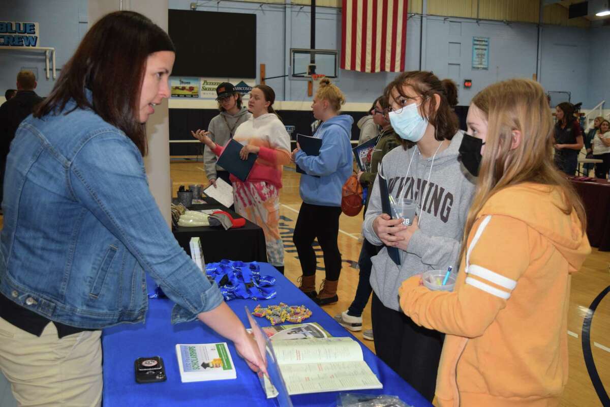 Holly Bauman (left), agriculture program specialist for Lincoln Land Community College,  talks Friday with freshmen Faith Embley (front) ad Ashton Stanberry during Triopia's FFA Leadership Day.