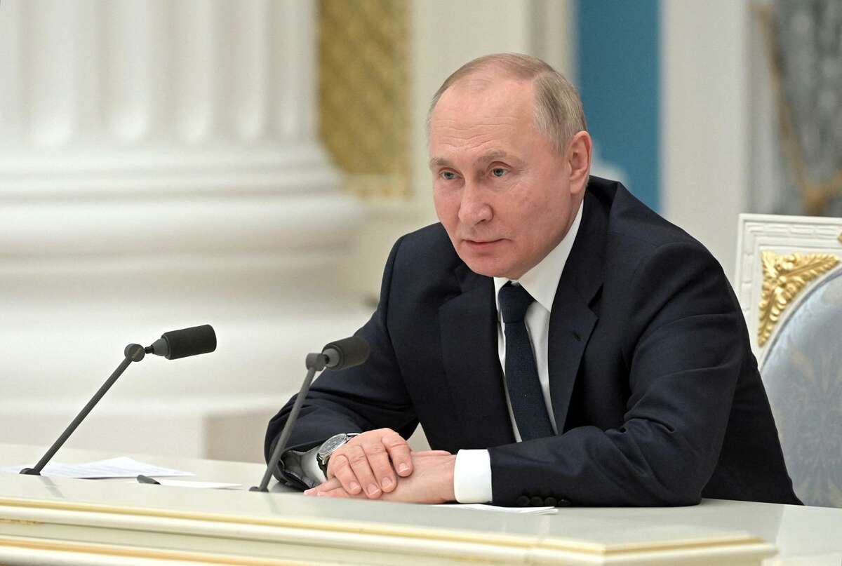 Russian President Vladimir Putin chairs a meeting at the Kremlin in Moscow on Thursday, Feb. 24, 2022. (Alexey Nikolsky/Sputnik/AFP via Getty Images/TNS)