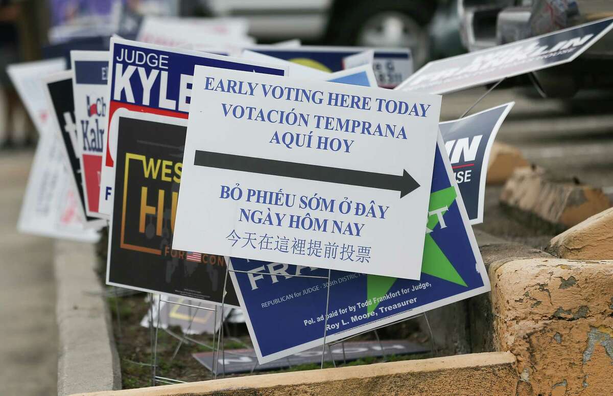 Election signs outside Trini Mendenhall Community Center during early voting on Tuesday, Feb. 22, 2022 in Houston.