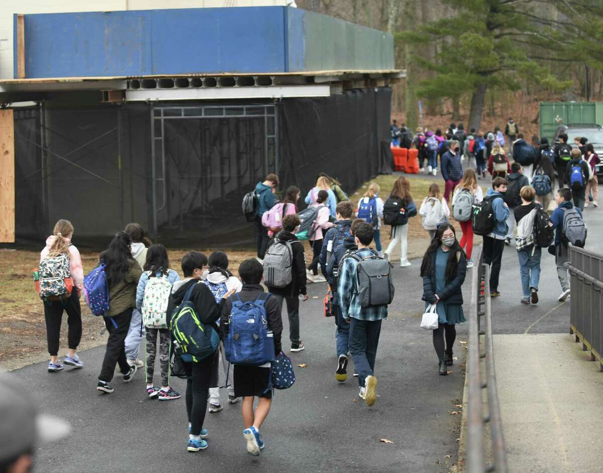 Students are dismissed on their first day back at Central Middle School in Greenwich, Conn. Tuesday, Feb. 22, 2022. Concerns about the building's stuctural integrity forced students to other schools earlier this month, but the issue has been resolved and students are now back at Central Middle School. Money is being sought to pay for those emergency repairs and begin work on designing a new school building.
