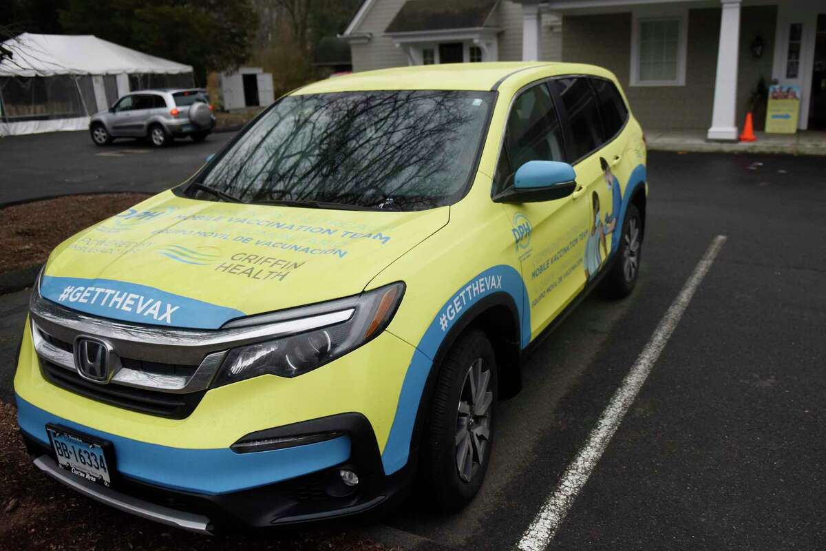A Griffin Health vaccine vehicle is parked outside the Person to Person Darien branch on the Saint Luke's Parish campus in Darien, Conn. Tuesday, Feb. 22, 2022. Person to Person hosted a free vaccination clinic in partnership with the Connecticut Department of Public Health for both initial and booster COVID vaccines for those ages five and up.