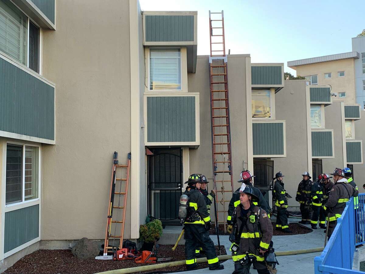 Firefighters at the scene of a deadly fire at 1212 Turk Street in San Francisco, Calif.