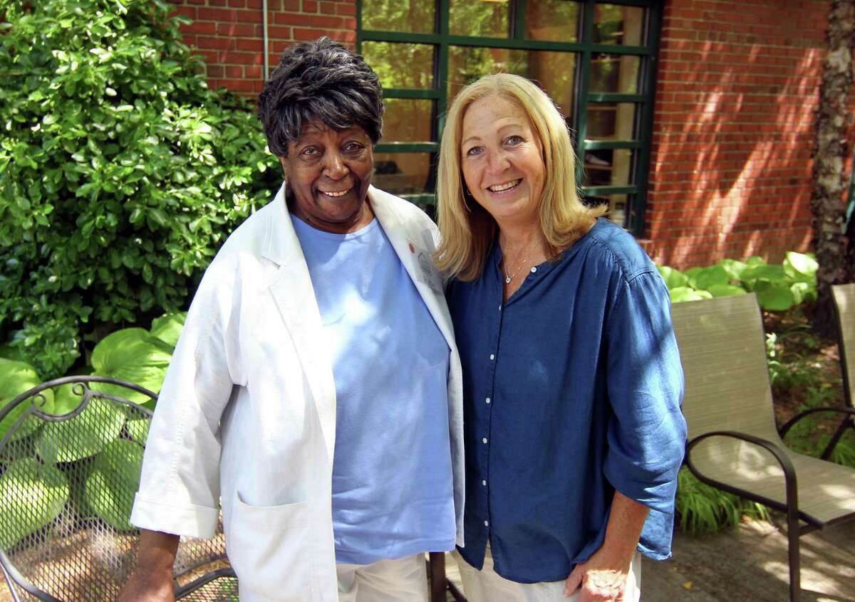 Ruby Berry, left, poses with River House Adult Day Center Director Donna Spellman in Greenwich, Conn., on Friday June 25, 2021. A first-of-its-kind report was released Thursday on senior citizens is meant to help communities support healthy aging by addressing nutrition, transportation, housing and more. The report shows racial and economic disparities among seniors in the state. Berry, a Stamford woman, who participates at Greenwich's River House three times per week, has a story that mirrors many others' experiences in the United States.