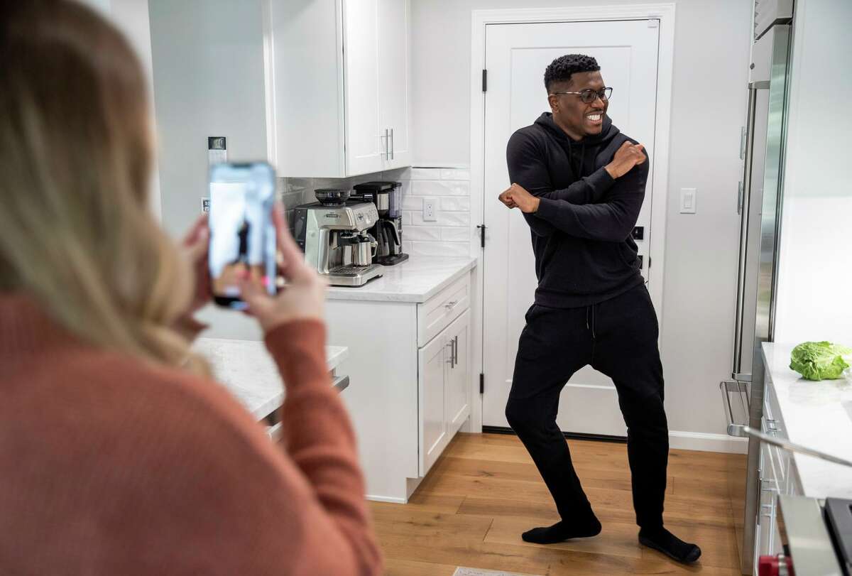 Lisa Duverneau uses TikTok to record her spouse, Emmanuel Duverneau, dancing and cooking dinner at their home in Walnut Creek.