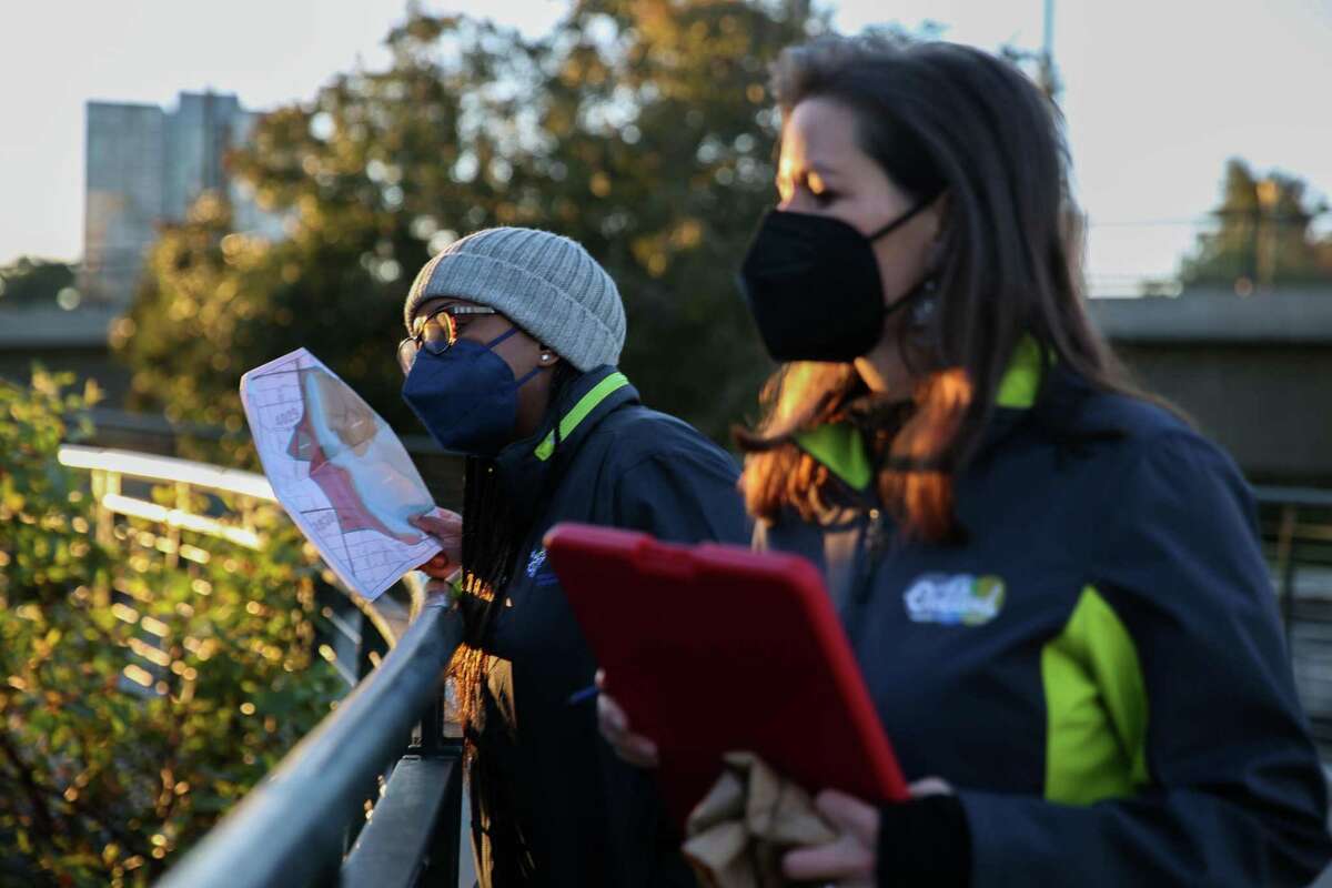 (From left to right) Executive director of EveryOne Home Chelsea Andrews and mayor Libby Schaaf walk together as they count homeless people around Lake Merritt on Wednesday, Feb. 23, 2022, in Oakland, Calif.