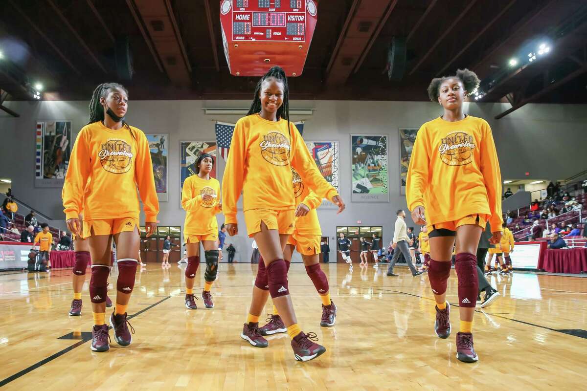 Beaumont United players warm up during the girls’ high school basketball playoff game between Beaumont United and Hendrickson on February 25, 2022 at the M.O. Campbell Center in Aldine, Texas.