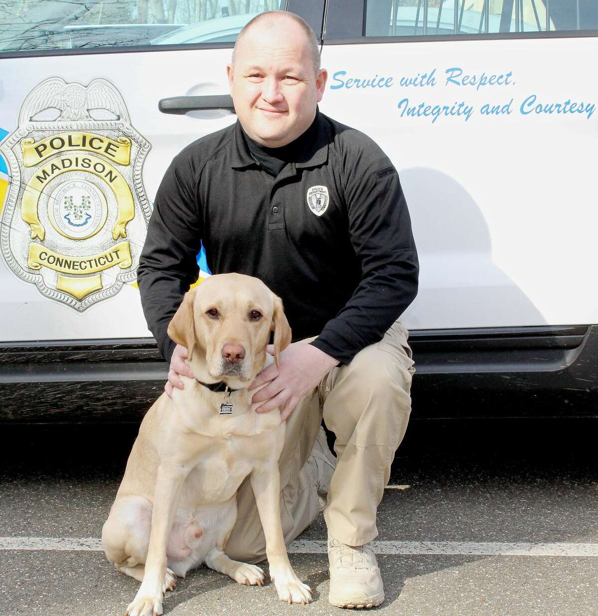 Madison Police Det. R. Neal Mulhern and his partner, Decker, the departments drug-sniffing canine.