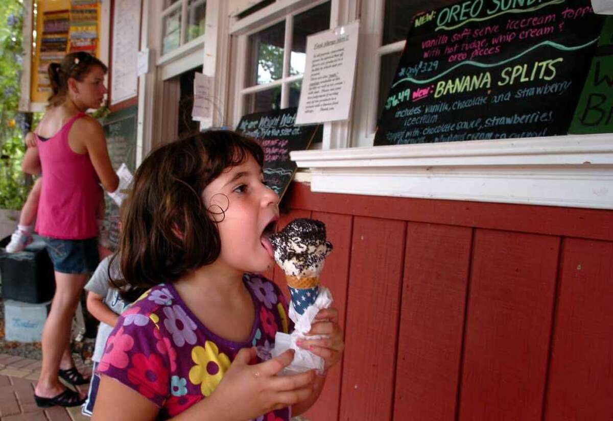 Six-year-old Rachel Sulkis, of Milford, enjoys an ice cream cone with sprinkles at Wells Hollow Farm in Shelton.