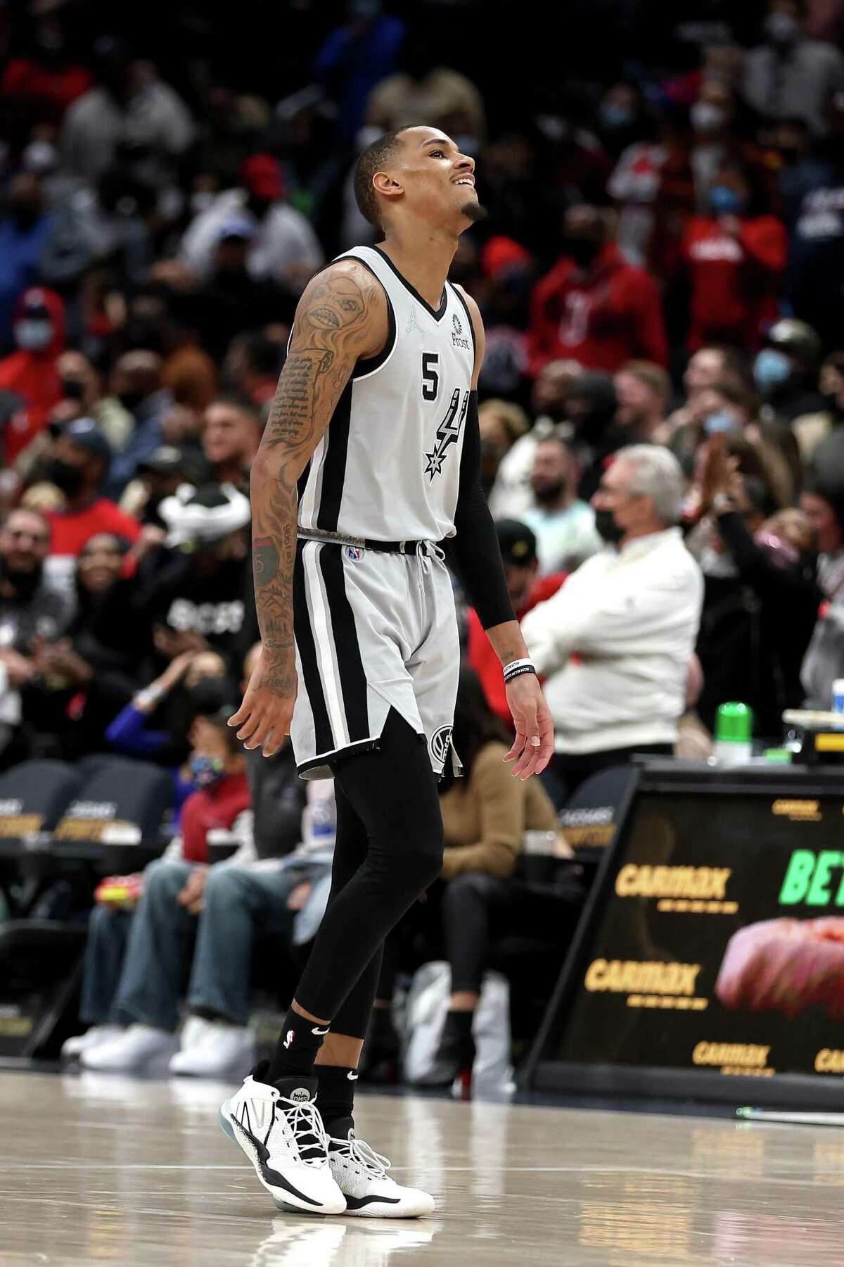 WASHINGTON, DC - FEBRUARY 25: Dejounte Murray #5 of the San Antonio Spurs reacts missing a shot in overtime against the Washington Wizards at Capital One Arena on February 25, 2022 in Washington, DC. NOTE TO USER: User expressly acknowledges and agrees that, by downloading and or using this photograph, User is consenting to the terms and conditions of the Getty Images License Agreement. (Photo by Rob Carr/Getty Images)