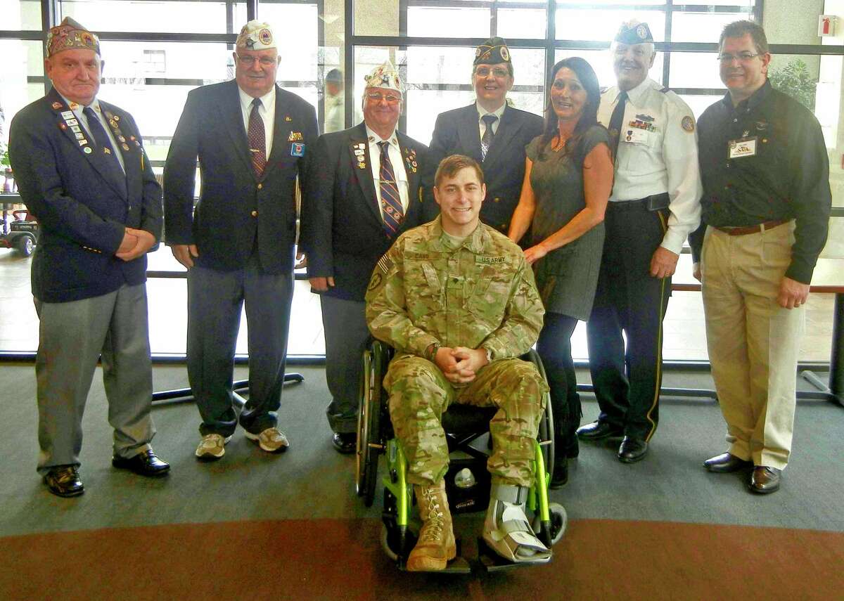 Operation Gift Cards representatives visiting Sergio Cano at Walter Reed Military Hospital in December 2011. Left to Right: Patrick Denehy, Bill Kosche, Jerry Thibodeau, Sergio Cano in wheelchair, Dana Dillion, Sergio's mother, Al Meadows, and Chris DeWitt.