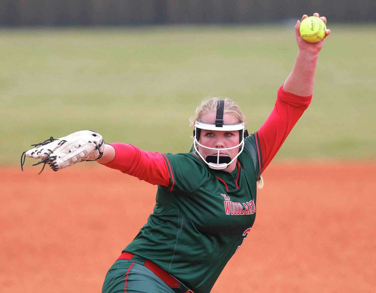 The Woodlands starting pitcher Saylor Davis (30) throws in the first inning of a non-district high school softball game at The Woodlands High School, Friday, Feb. 25, 2022, in The Woodlands.
