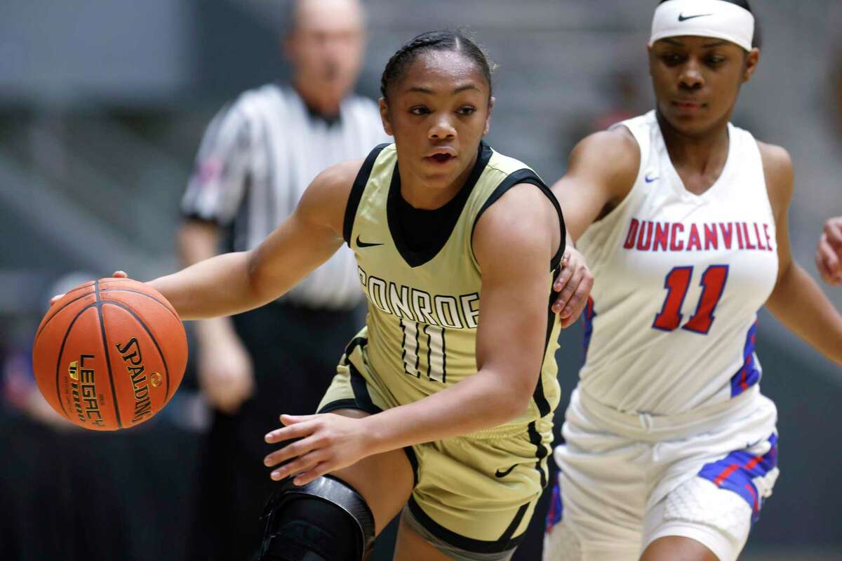 Conroe’s Kennedy Powell (11) handles the ball against Duncanville during the semifinals of the Regional II-6A girls basketball tournament at Davis Fieldhouse Friday, Feb. 25, 2022, in Dallas, Texas. (AP Photo/Ron Jenkins)