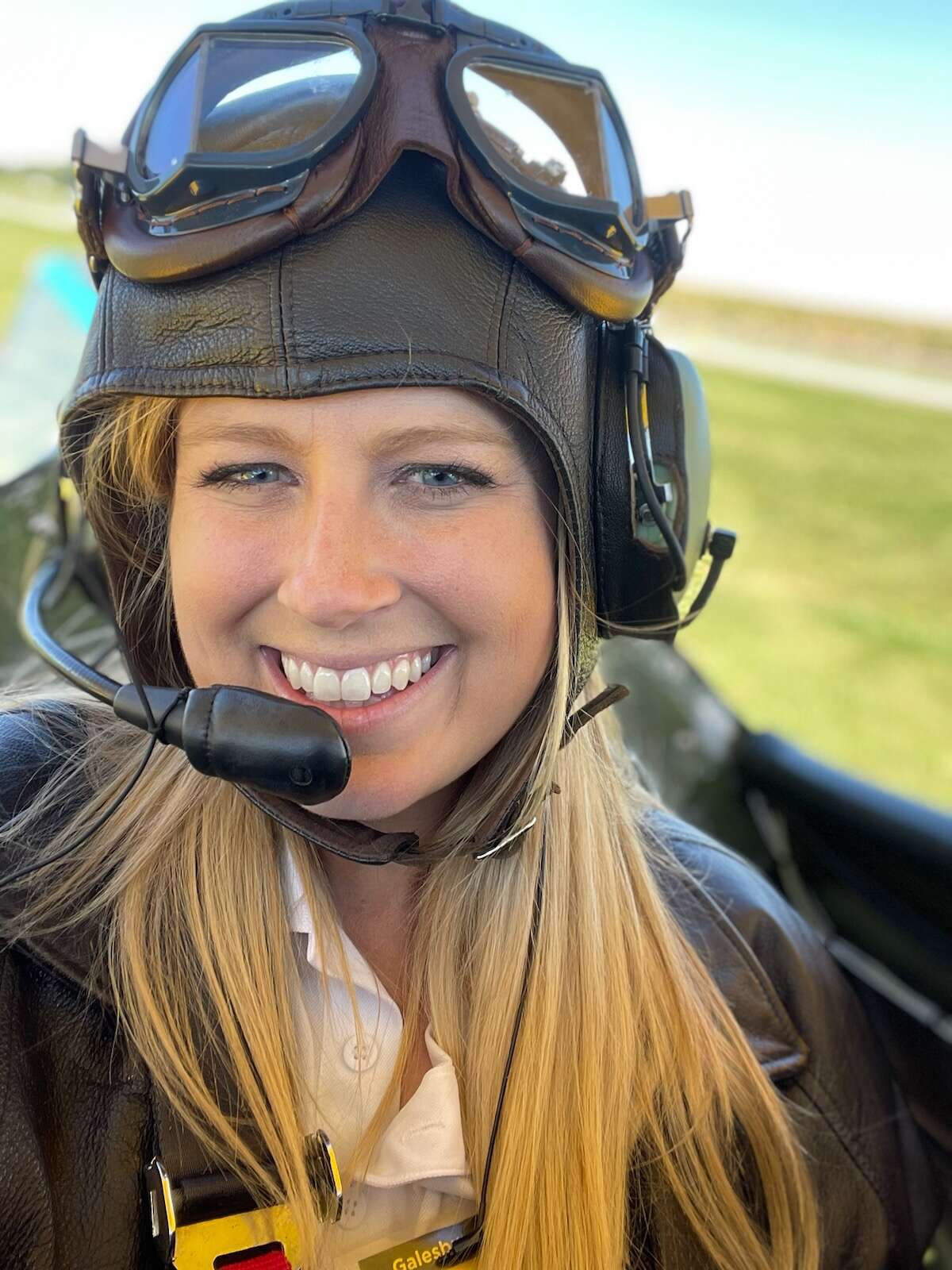 Alyssa VanMeter sits in the cockpit of a Stearman biplane during last year's Dream Flights Mission.
