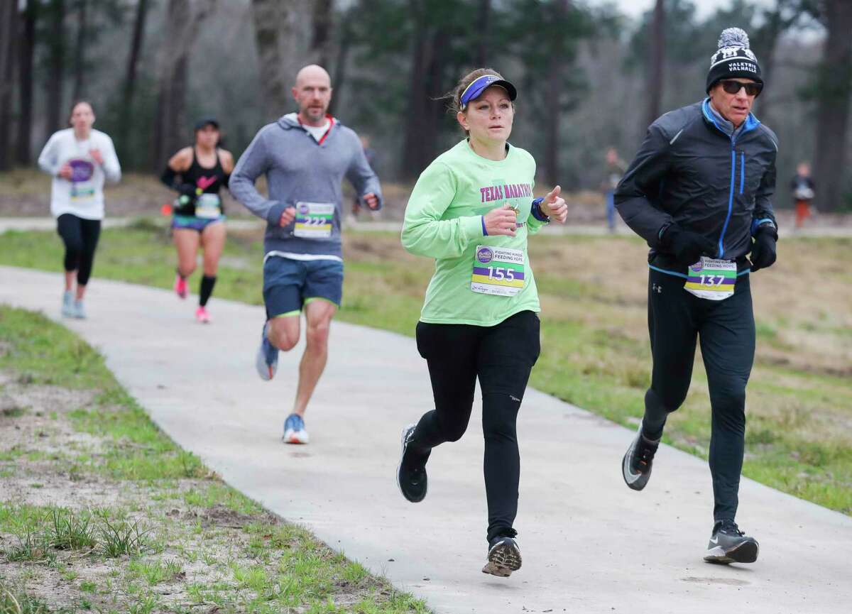 Runners take part in Montgomery County Food Bank’s inaugural Outrun Hunger fun run at Grand Central Park, Saturday, Feb. 26, 2022, in Conroe.