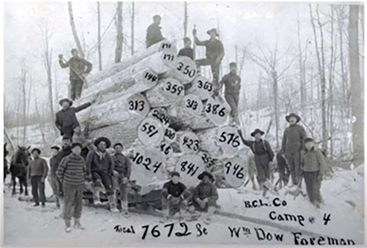 Skinner Lumber Camp, Henrietta, circa 1900. Pictured is Lon Seaton, William Todd and John Todd.