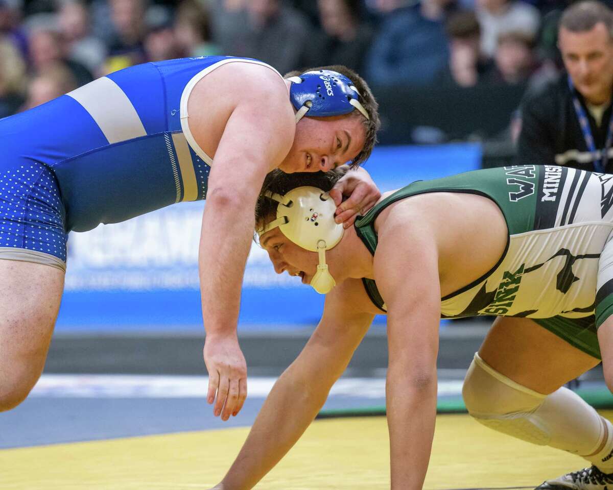 Ryan Stein, left, of Shaker, wrestles Ethan Gallo of Minisink Valley in the Division I, 215-pound state final. Stein finished with a loss in the final, but was grateful he was able to come back from a shoulder injury to go as far as he did.