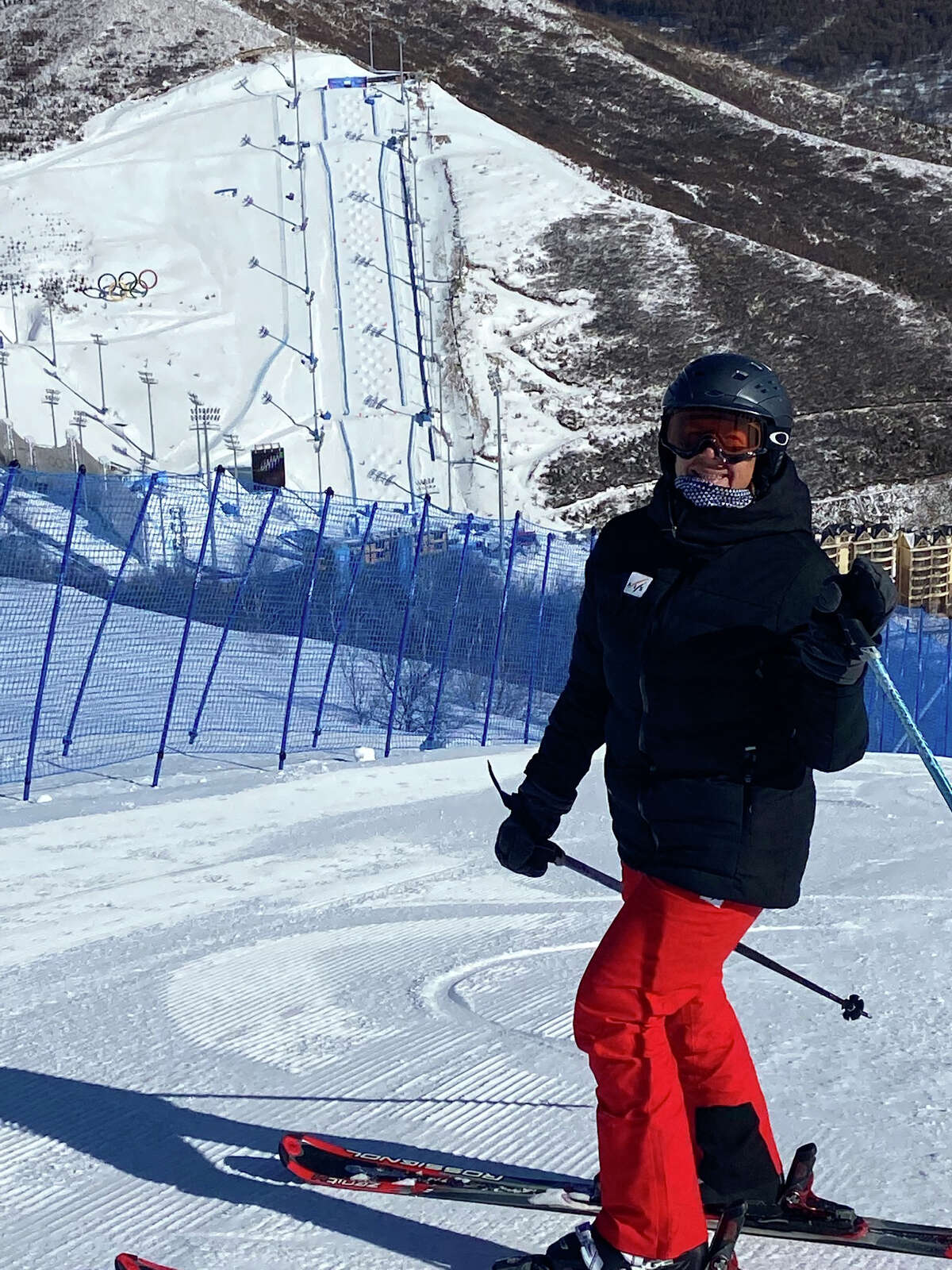 Sarah Simson of Niskayuna was a judge in freestyle skiing in Zhangjiakou during the 2022 Beijing Olympic Games. Here she is skiing above the half pipe and slope style courses. The mogul course and rings are in the background.
