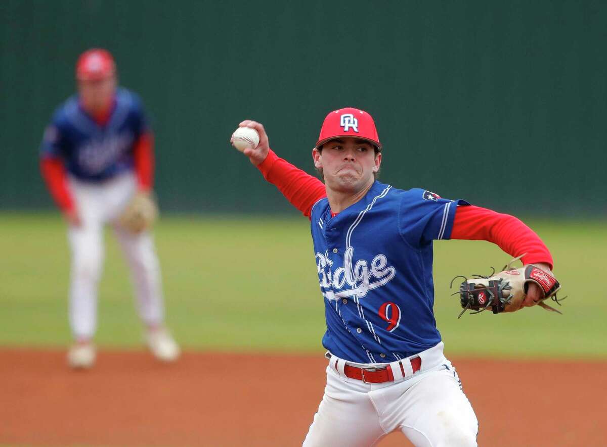 Oak Ridge starting pitcher Conner Bennett (9) throws in the first inning of a non-district high school baseball game against Kingwood Park, Saturday, Feb. 26, 2022, in Kingwood.