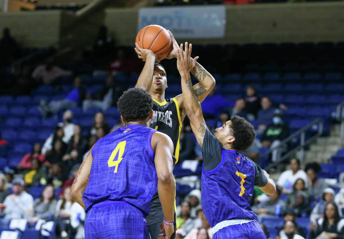 Beaumont Panthers guard Kenan Williams (5) shoots ove a couple the Sugarland Imperials at Ford Park in Beaumont, TX. Photo taken February 26, 2022 by Jarrod Brown