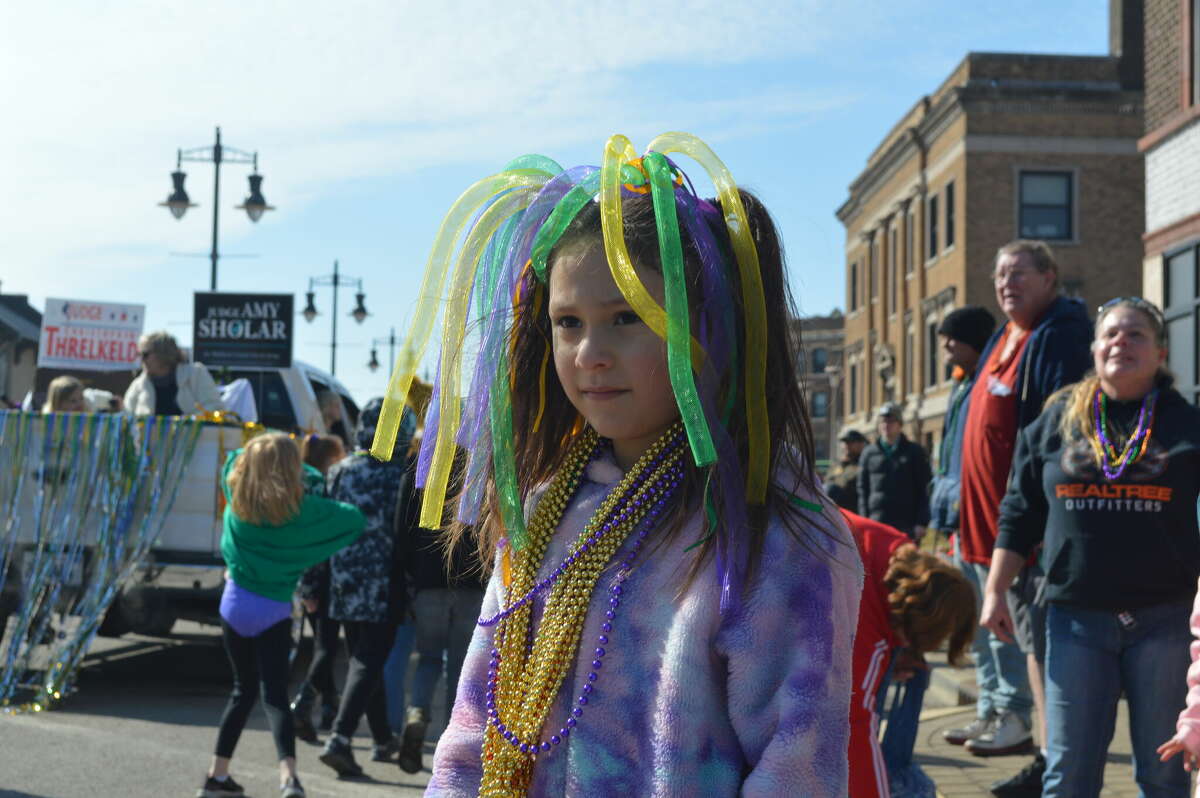 Isabella Gutierrez awaits beads and candy during the inaugural Granite City Mardi Gras parade Saturday.