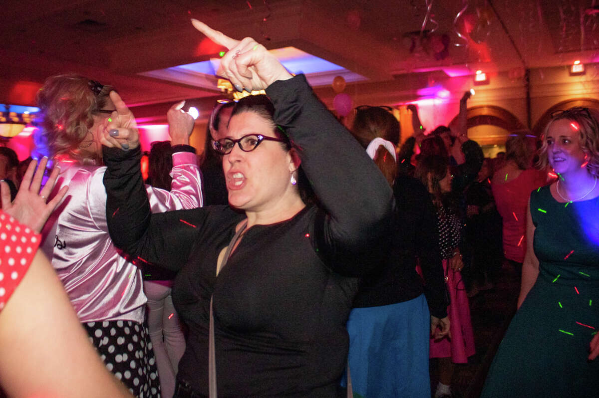 Becky Wotring dances during the Great Lakes Bay Mom Prom on Saturday, Feb. 26, 2022 at the Great Hall Banquet and Convention Center.
