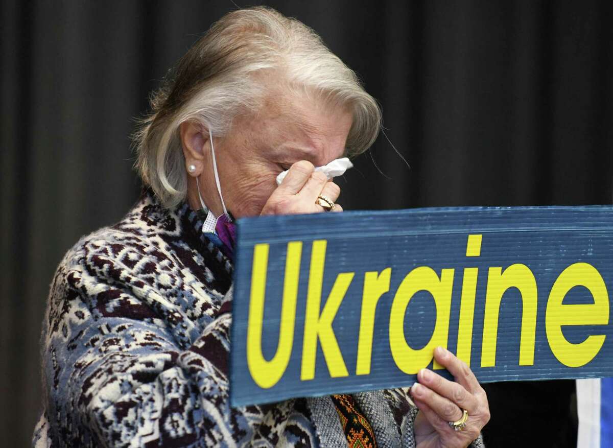 West Haven's Romanna Czerepacha tears up during the singing of the Ukrainian National Anthem at the Ukraine press conference and rally at St. Michael the Archangel Ukrainian Catholic Church in New Haven, Conn. Sunday, Feb. 27, 2022. Connecticut Gov. Ned Lamont, U.S. Sen. Richard Blumenthal, D-Conn., U.S. Rep. Rosa DeLauro, D-Conn., and local Ukrainian leaders gathered to show support for Ukraine and denounce the Russian invasion.