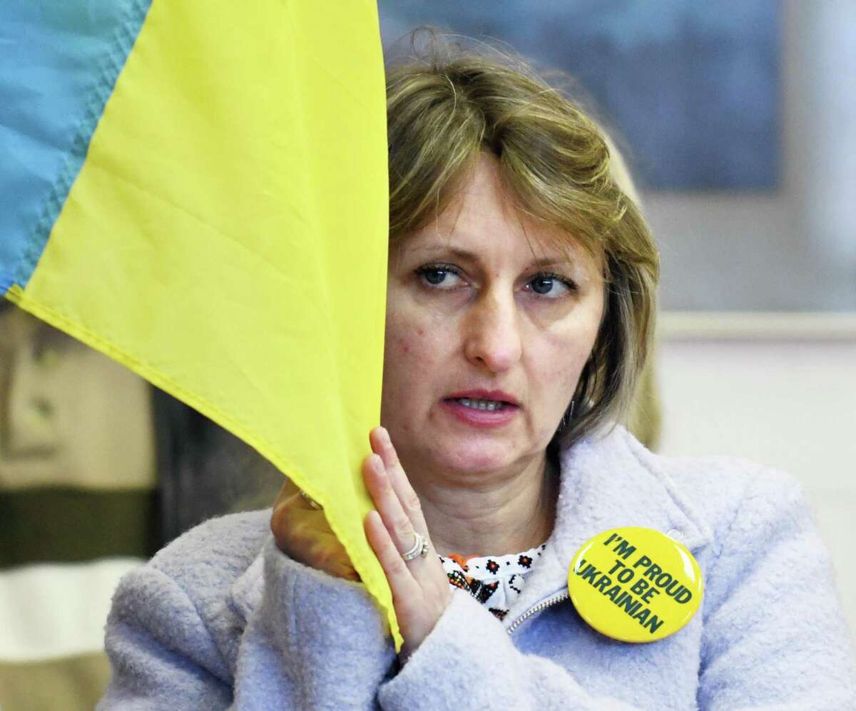 East Haven's Natalie Chermak holds a flag during the Ukraine press conference and rally at St. Michael the Archangel Ukrainian Catholic Church in New Haven, Conn. Sunday, Feb. 27, 2022. Connecticut Gov. Ned Lamont, U.S. Sen. Richard Blumenthal, D-Conn., U.S. Rep. Rosa DeLauro, D-Conn., and local Ukrainian leaders gathered to show support for Ukraine and denounce the Russian invasion.