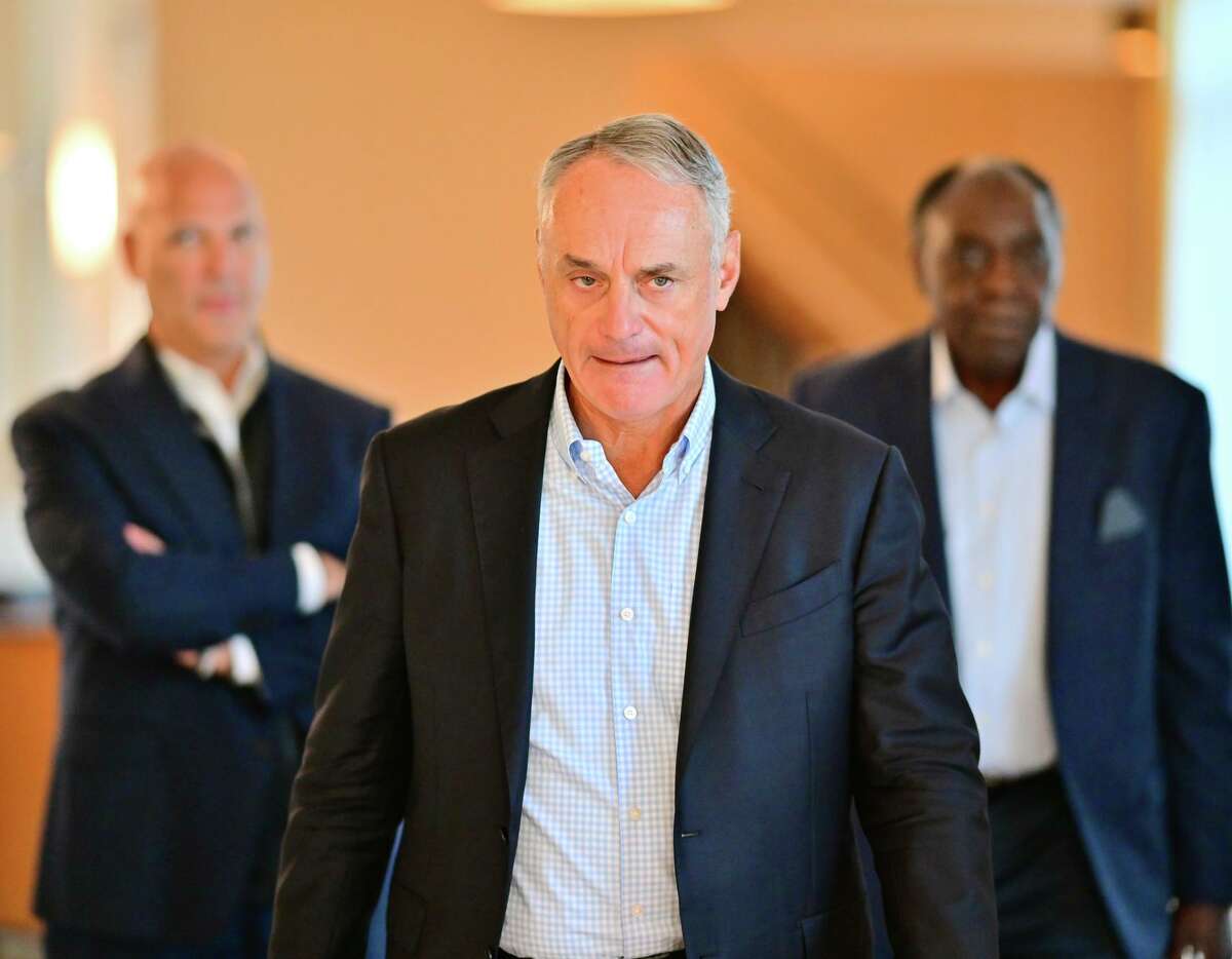 ORLANDO, FLORIDA - FEBRUARY 10: Major League Baseball Commissioner Rob Manfred walks to a press conference during an MLB owner's meeting at the Waldorf Astoria on February 10, 2022 in Orlando, Florida. Manfred addressed the ongoing lockout of players, which owners put in place after the league's collective bargaining agreement ended on December 1, 2021. (Photo by Julio Aguilar/Getty Images)