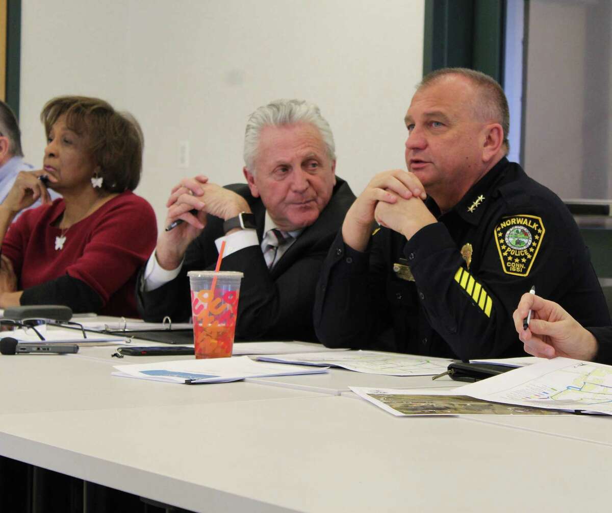 Mayor Harry Rilling (center) attends a Norwalk Police Commission meeting in 2019. On Monday, he appointed city resident and insurance broker Tony Lopez to the three-member commission.