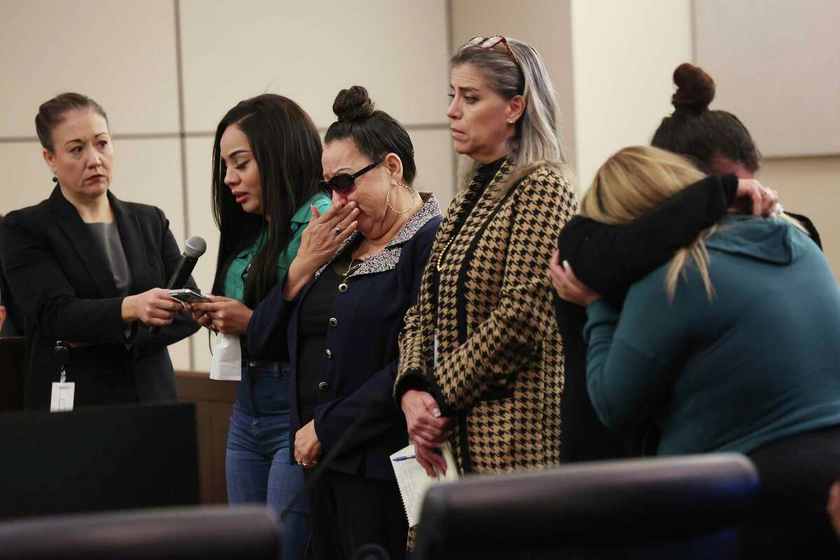 Belkis Guerrero, second from left, reads an impact statement after her brother’s killer is handed a 50 years sentence during a hearing in the 226th District Court on Monday. Next to her on the right is their mother, Amelia Vega Mendoza. Delgado was convicted of murder for killing Luis Guerrero, 35, on Feb. 21, 2020.